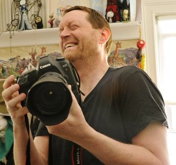 Russell E. Murray - REMAGES - Portrait with his digital SLR in hand.